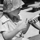 A Brownie demonstrates how to make Ants on a Log, 1971